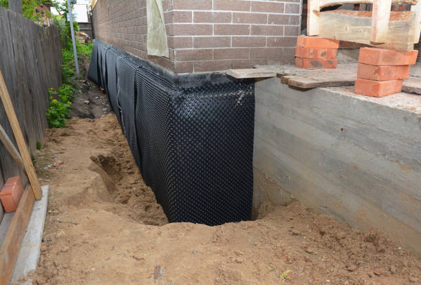 SJ Waterproofing Pros technician performing targeted Interior Drainage System assessment in Towanda, KS
